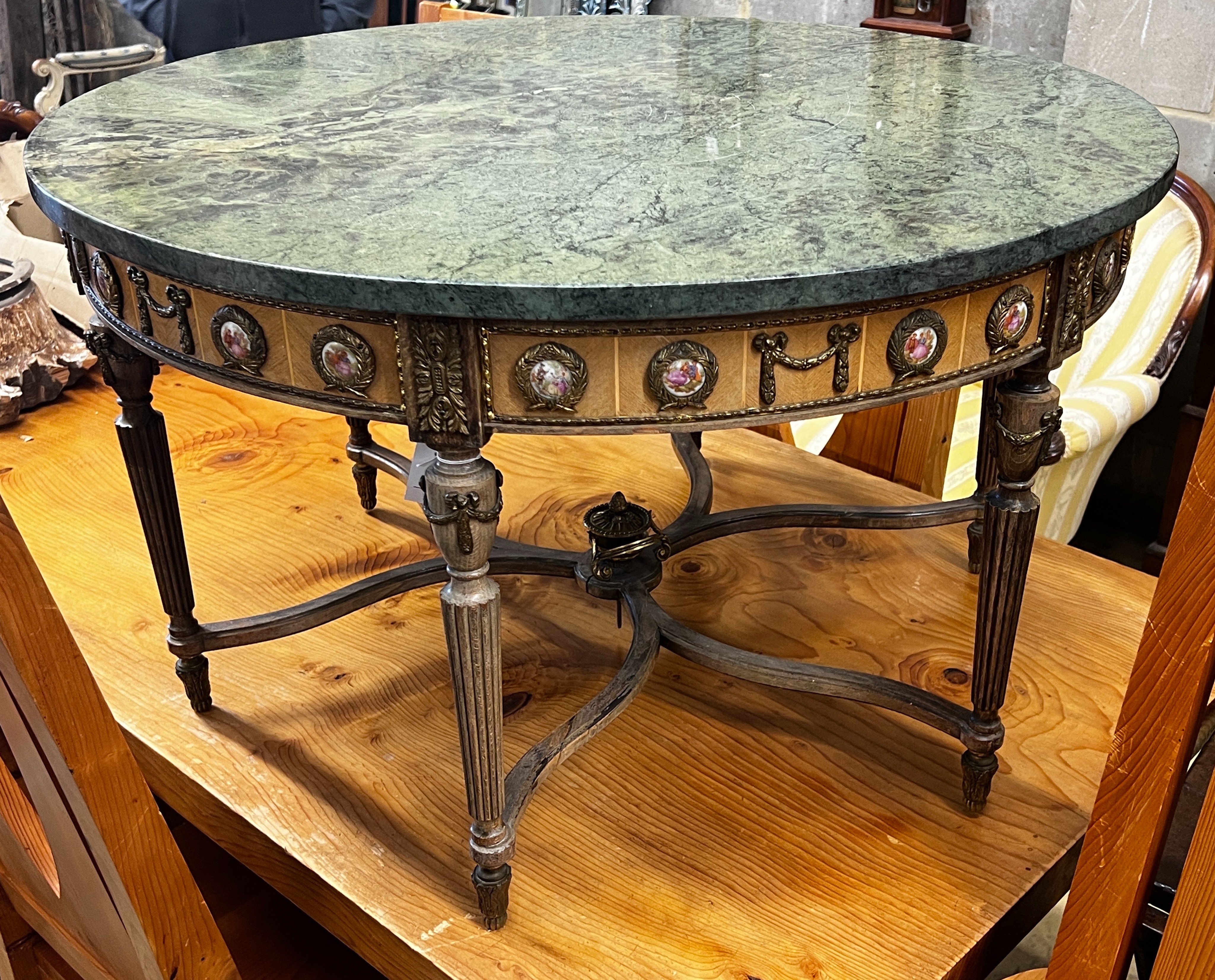 A Louis XVI design circular gilt metal and porcelain mounted marble top coffee table, diameter 84cm, height 48cm